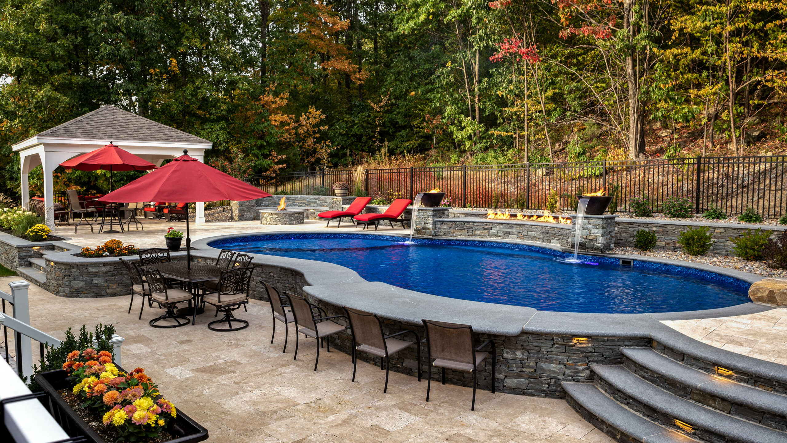 Backyard pool with bar built into pool.
