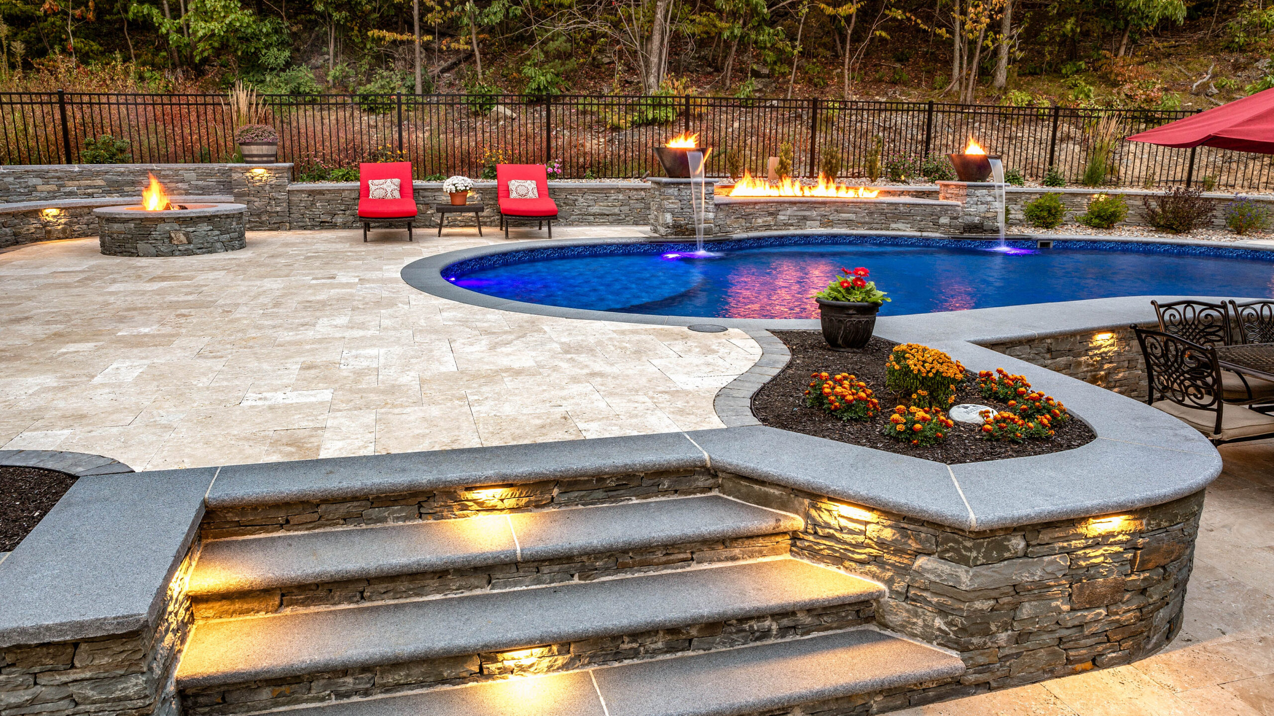 Close up of the lighted stairs leading to the pool area.