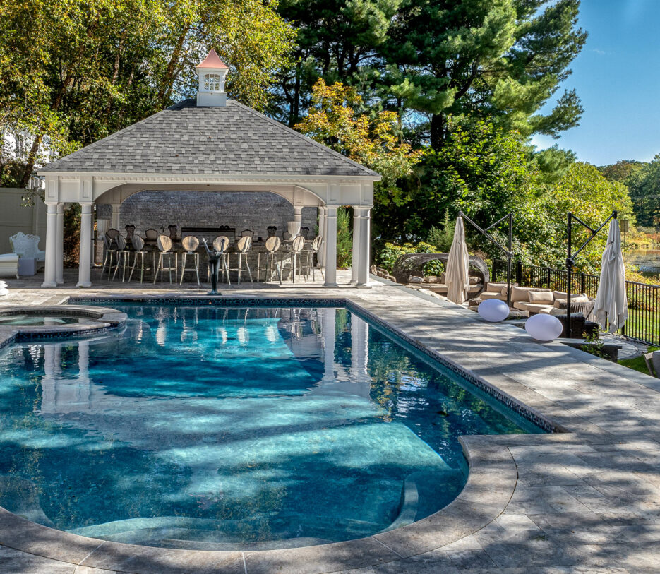 Gibson pool area with a hot tub and cabana.