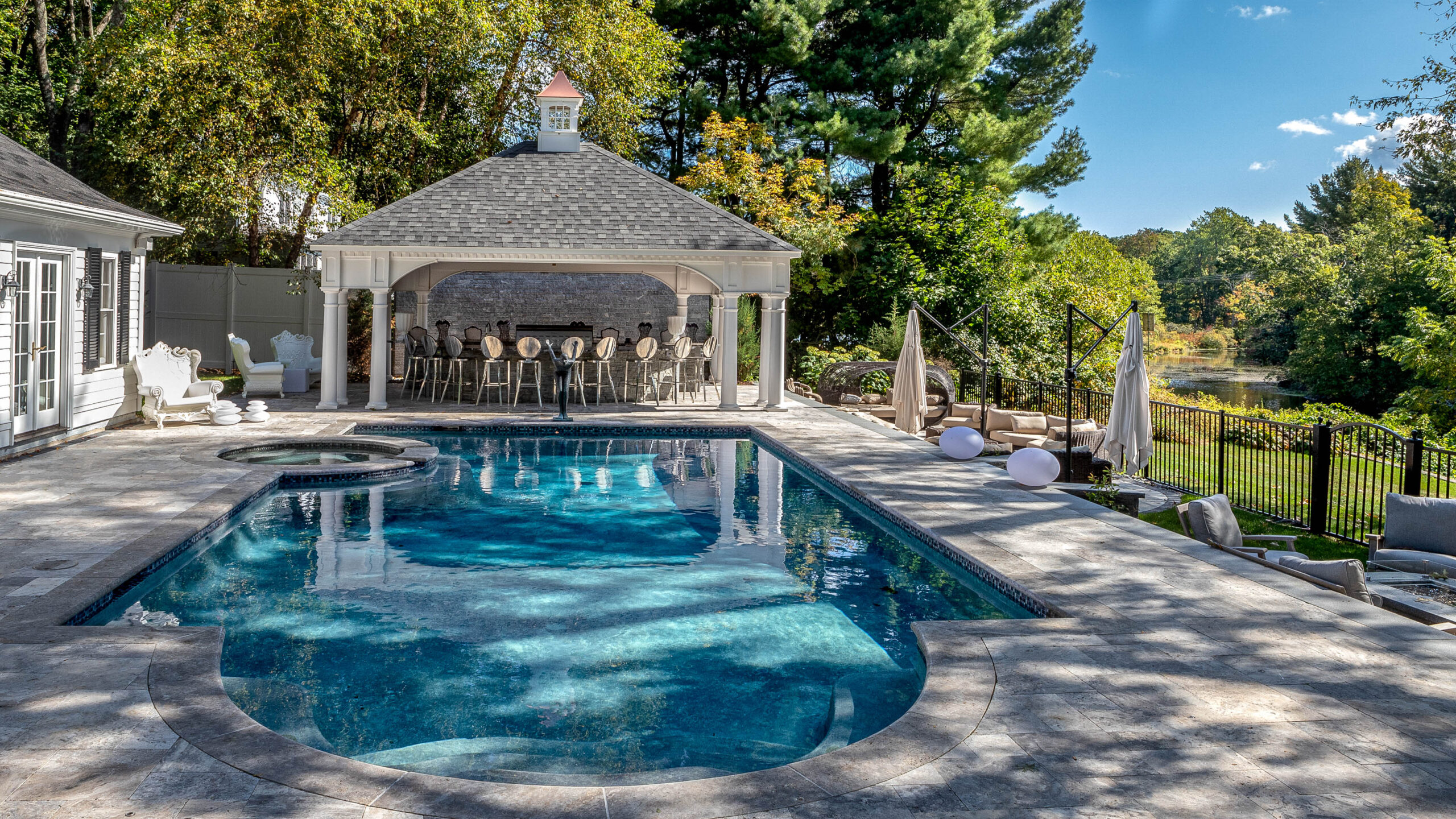 Gibson pool area with a hot tub and cabana.