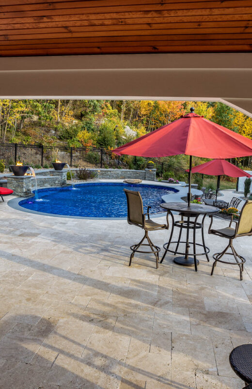 View of the pool area from under the cabana.