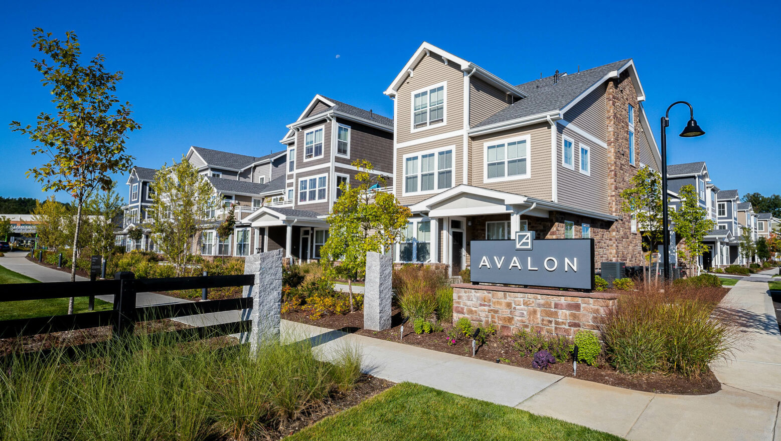 Avalon Apartments sign with landscaping. Dex by Terra Commercial Landscape Design-Build project.