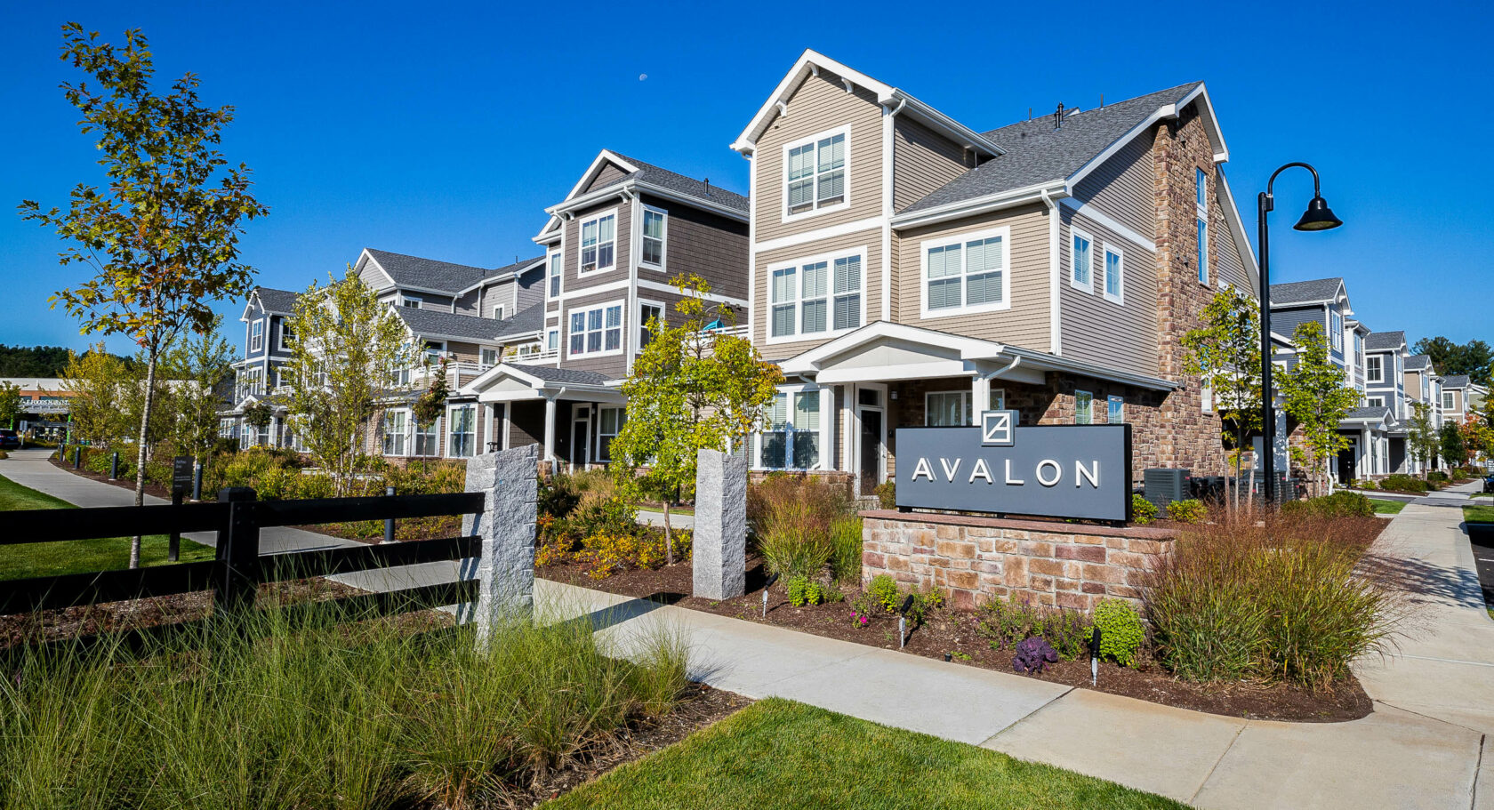 Avalon Apartments sign with landscaping. Dex by Terra Commercial Landscape Design-Build project.