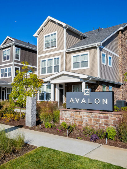 Avalon Apartments sign with landscaping. Dex by Terra Commercial Landscape Design-Build project.