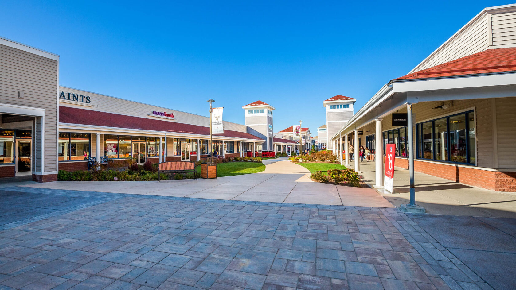 Paver and concrete flatwork walkways at Dex By Terra's commercial hardscape project at the Wrentham Outlets in Wrentham, MA.