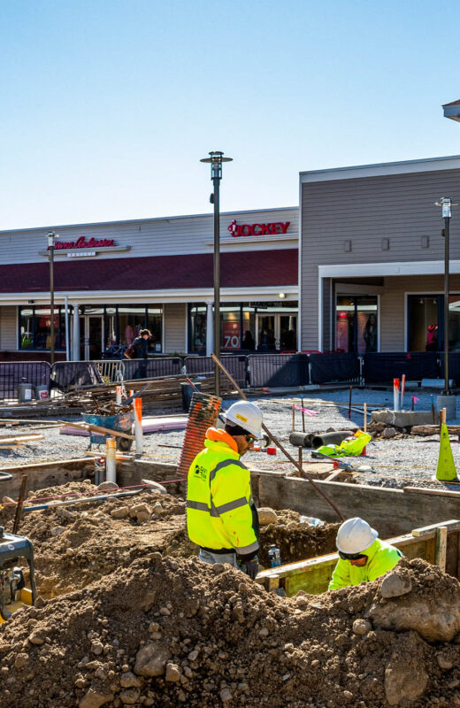 Workers doing construction on Wrentham shopping center.