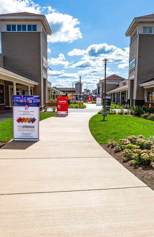 Wrentham shopping center with concrete walkways.