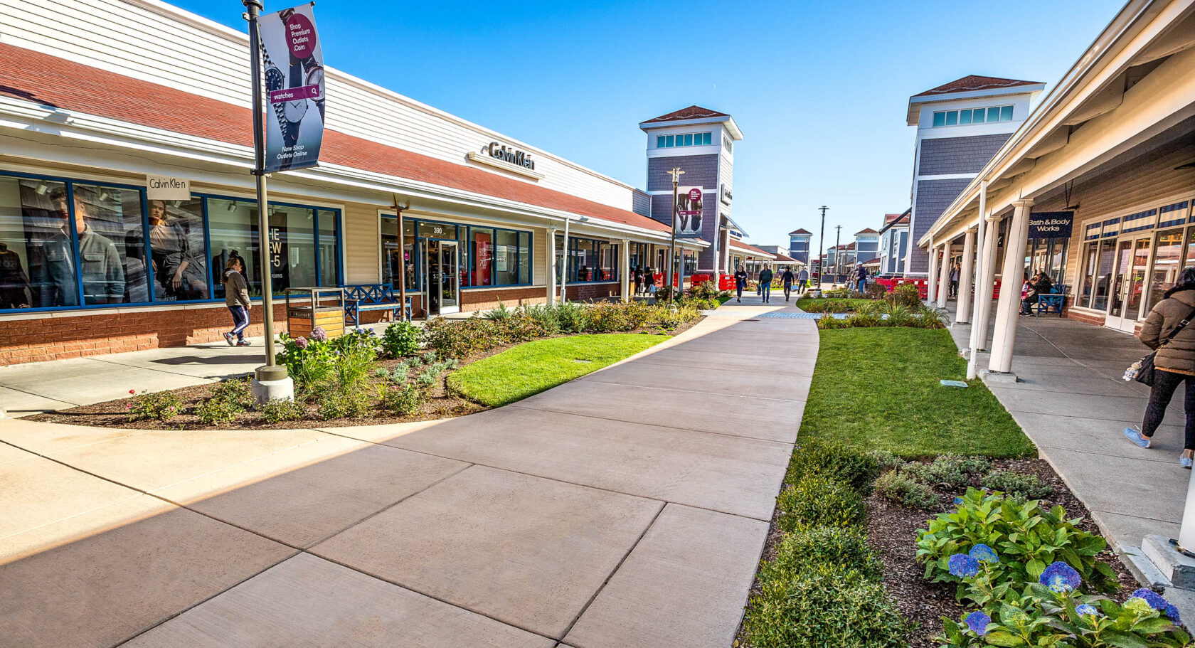 Wrentham shopping center with concrete walkways.