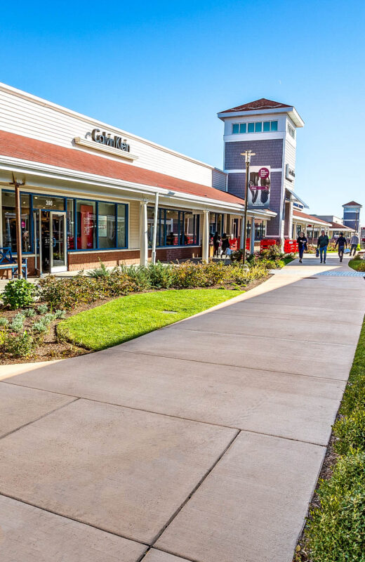 Wrentham shopping center with concrete walkways.