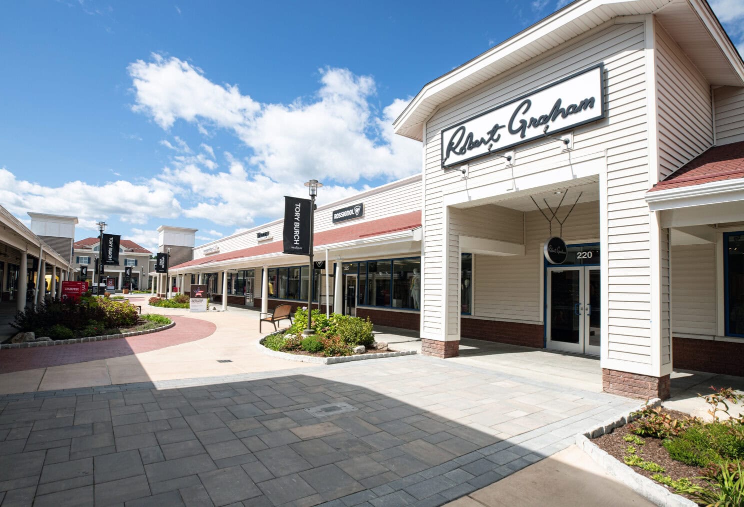 Commercial Landscape Design & Build Project at the Wrentham Outlets in MA. Paver and concrete walkways by Dex by Terra.