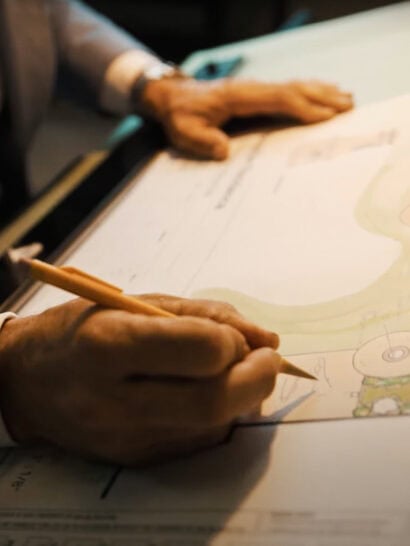 Designer drawing on plans