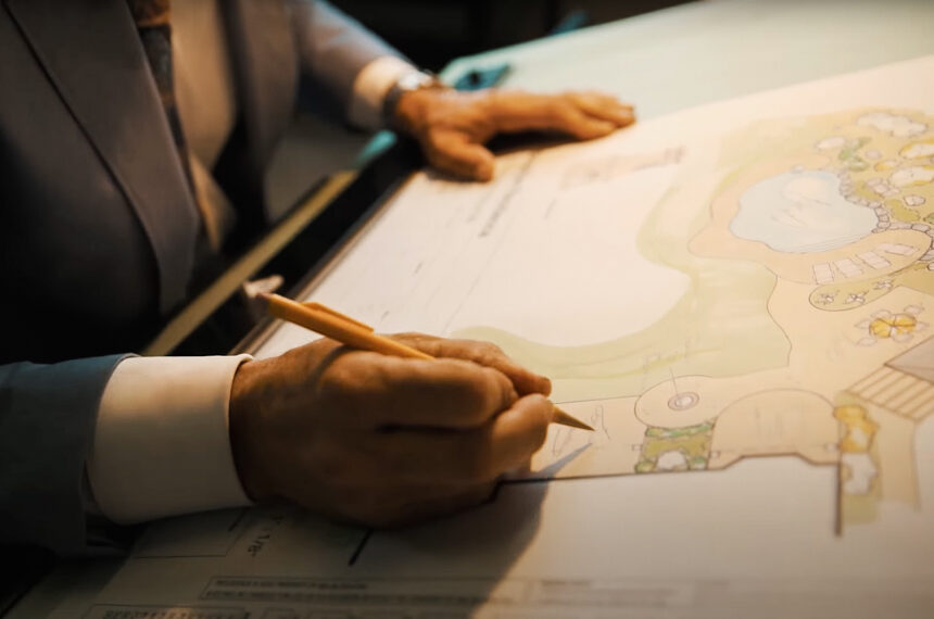 Designer drawing on plans