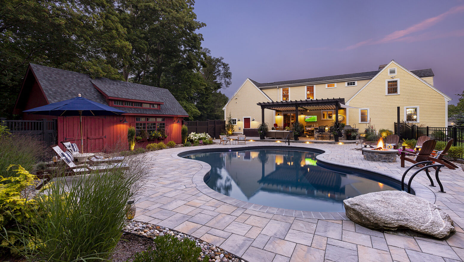 Paver Pool deck with Jump Rock and Fire Pit at Dex by Terra's Residential hardscape/landscape project in Stow, MA.
