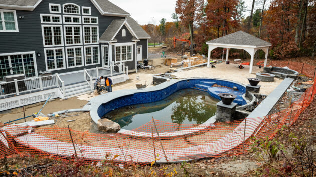 The backyard during the pool construction.