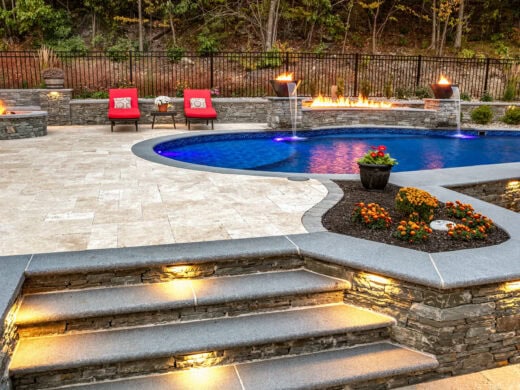 Close up of the lighted stairs leading to the pool area.