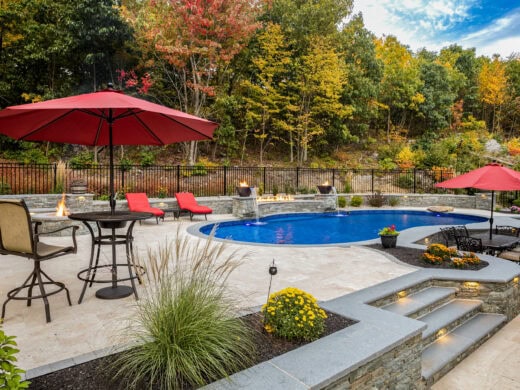 Entire pool area with multiple seating areas.