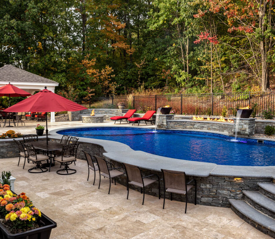 Backyard pool with bar built into pool.