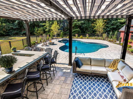 View of the pool from under a cabana.