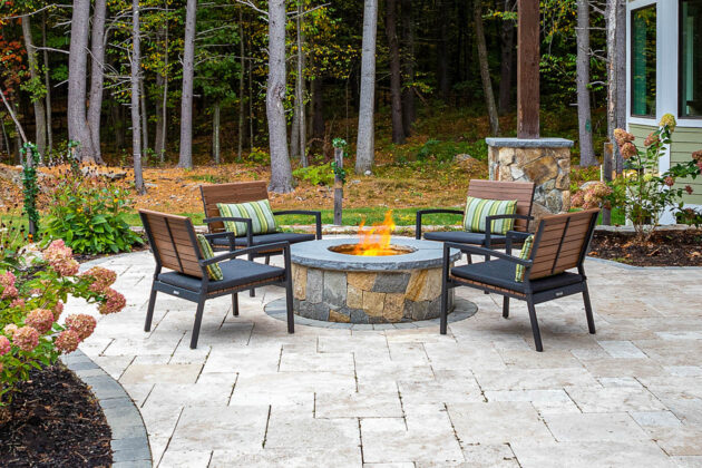 Hardscaping. Backyard fit pit with chairs.