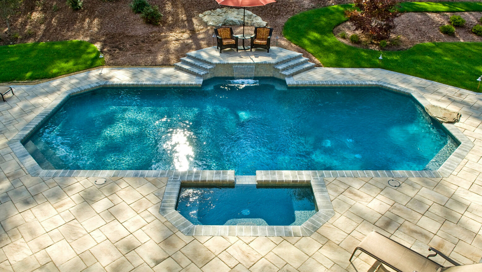 Pool with a water feature.