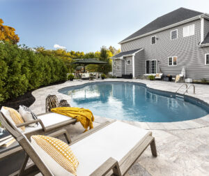 Lounge chairs by the pool. Dex by Terra Residential Landscape Design & Build Project in Shrewsbury, Massachusetts