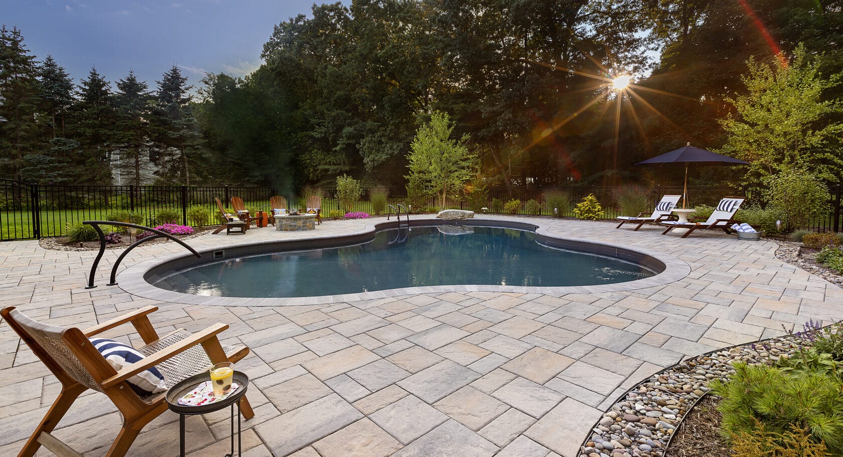 Stow MA Pool sunset behind trees