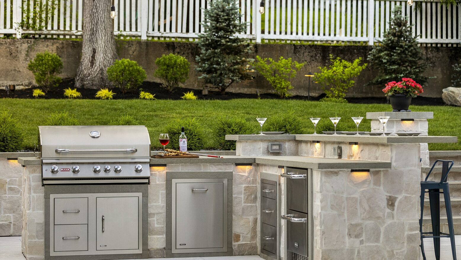 Outdoor kitchen in Needham, Massachusetts with stainless steel gas grill from Bull Grills. Built by Dex by Terra.