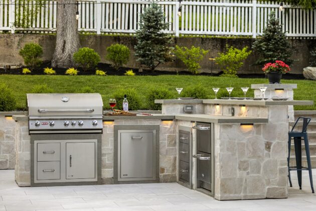 Outdoor kitchen in Needham, Massachusetts with stainless steel gas grill from Bull Grills. Built by Dex by Terra.
