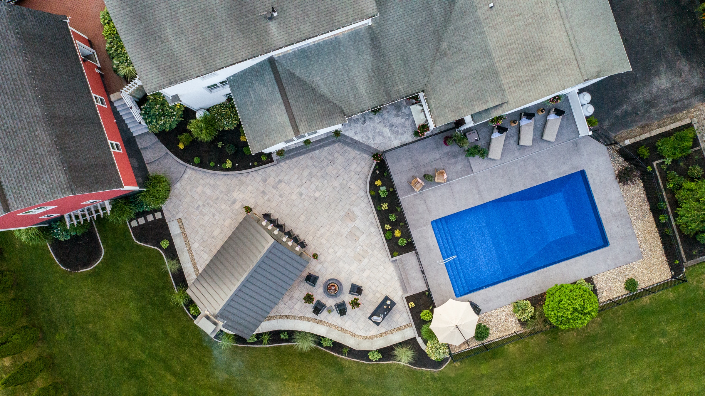 Aerial view of the backyard renovation project designed and built by Dex by Terra in Auburn Massachusetts.