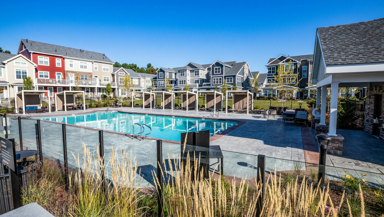 Stamped & colored concrete pool deck at the Avalon apartment complex in MA. Dex by Terra commercial hardscape project.
