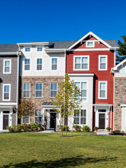 Apartment houses with grassy lawn.
