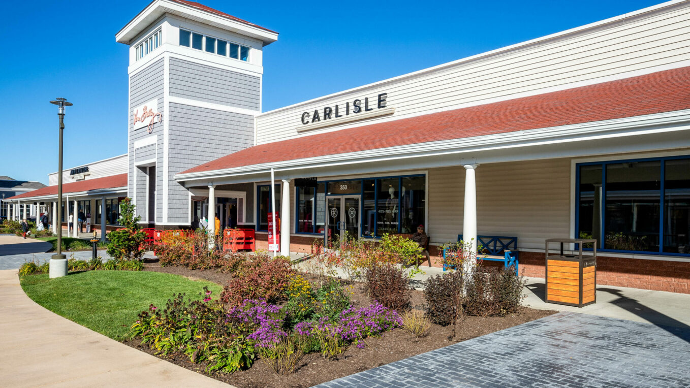 Flower bed with landscaping and concrete walkways at the Wrentham Outlets. Dex by Terra Hardscape and Landscape project.