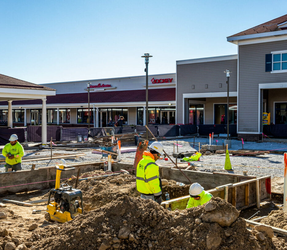 Workers doing construction on Wrentham shopping center.