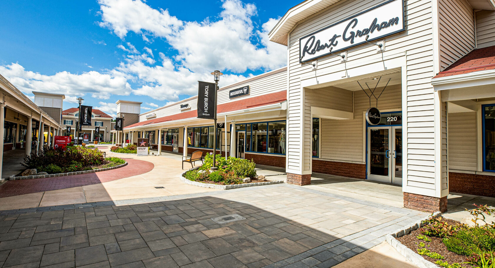Store fronts at Wrentham shopping center. Paver and concrete walkways. Dex by Terra Commercial Hardscape project.