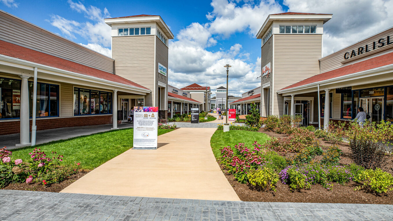 Wrentham shopping center with concrete walkways.