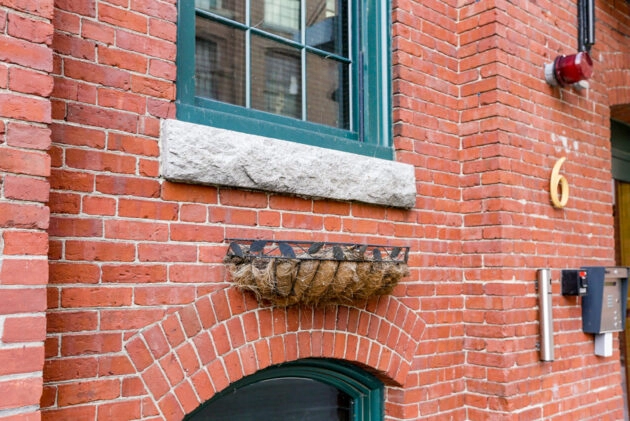 Converted warehouse with brick exterior after restoration & repointing. Dex by Terra Commercial Masonry project in MA.