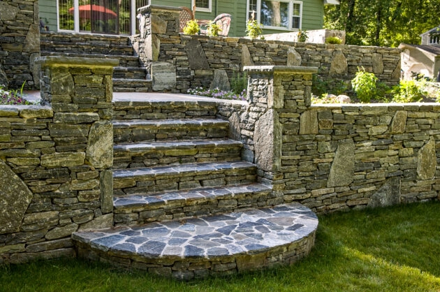 Tiered Natural Stone Retaining Walls and Staircases. Dex by Terra masonry service in MA & NH.