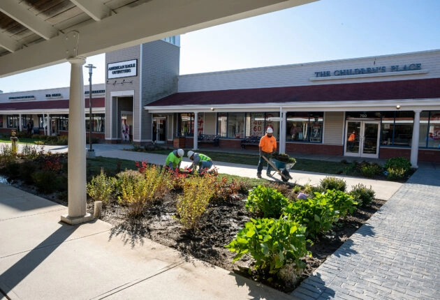 Dex by Terra workers installing landscaping at the Wrentham Outlets in Wrentham, Massachusetts.